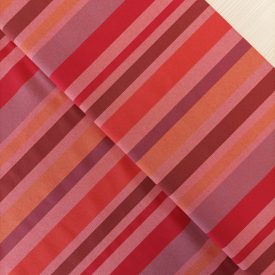   Mintás dekorvászon mályva / bordó / piros / narancssárga csíkos 140-144 cm