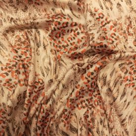   Mintás vékony szatén fehér, narancssárga, barna ocelot minta 142 - 144 cm