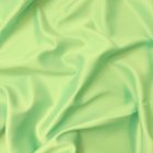 Ruha szatén halvány zöld 145 - 150 cm széles