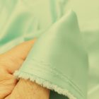 Ruha szatén halvány zöld 145 - 150 cm széles