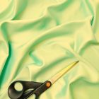 Ruha szatén halvány zöld 145 - 150 cm széles